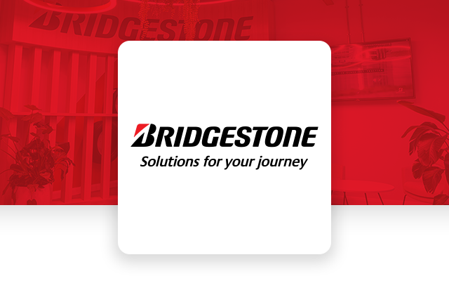 Bridgestone branded visual highlighting innovative solutions and a modern corporate environment within a professional workspace.