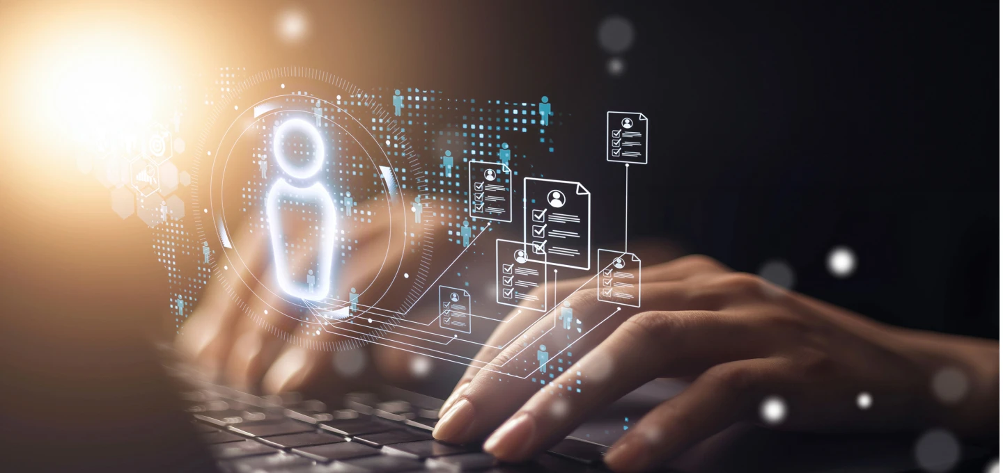 A person typing on a keyboard with digital icons representing data and people hovering above their hands.