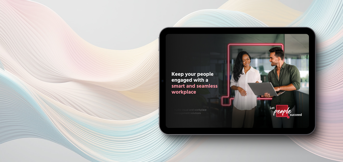 Smart workplace guide cover showing two colleagues reviewing a laptop in a modern office.
